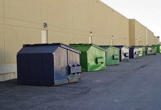 metal waste containers sit at a busy construction site in Center Point IA